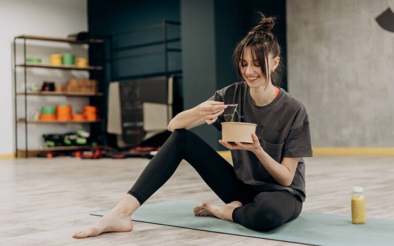 A woman enjoying a post workout meal that falls in line with the keto diet for weight loss.