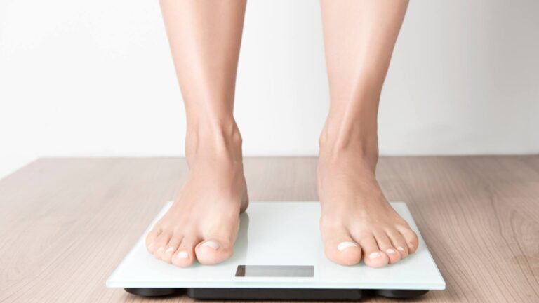feet standing on weight scale