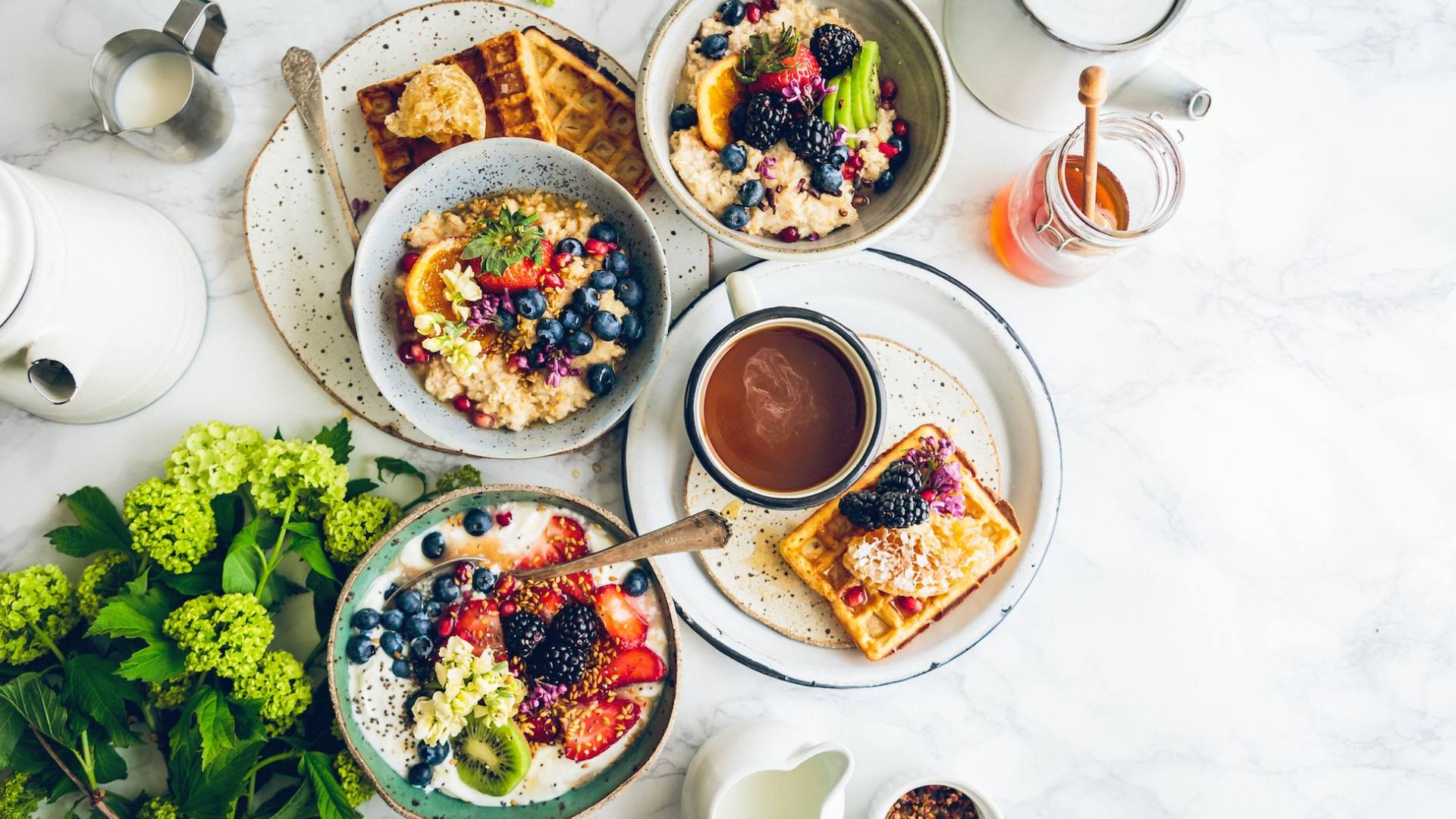 real food like waffles, berries, yogurt, and more on a table